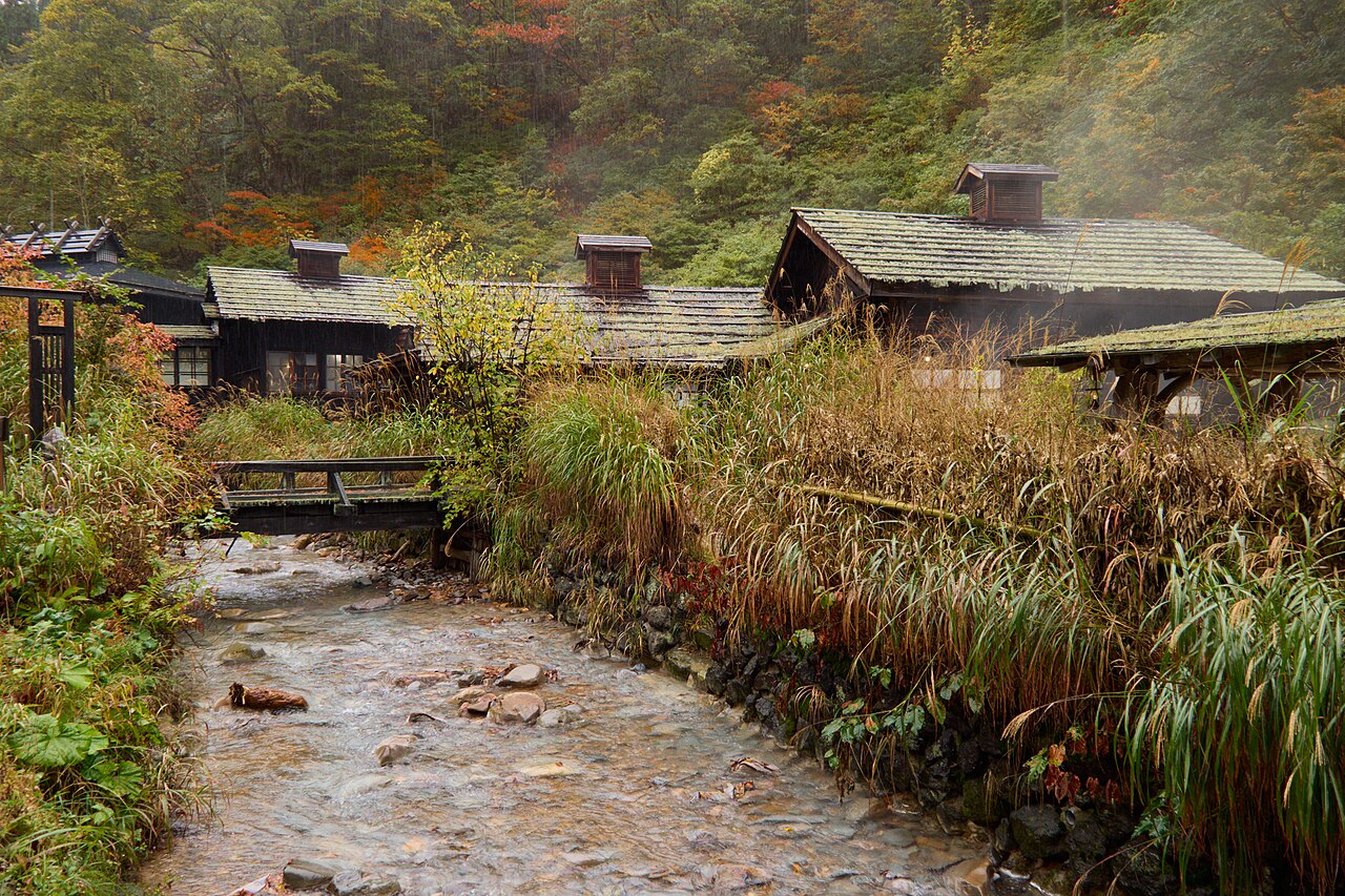 Thatched and timber bathhouse buildings of Tsuru-no-yu at Nyuto Onsen, Akita — one of the best-known surviving mixed baths.